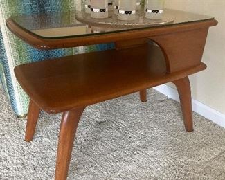 Living Room:  A vintage HEYWOOD-WAKEFIELD end table has a custom protective glass top.