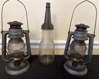 Garage:  A PAIR of #864 MEVA Czech kerosene paraffin railroad lanterns (10" tall) flank a quart bottle with metal funnel labeled "The Master."