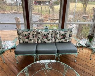 Sun Room:  A pair of 24" round glass top Woodard "Chantilly Rose" side tables is priced separately from the 79"  matching three-section sofa.  