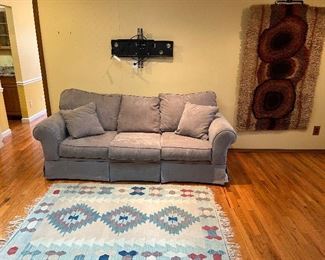 Family Room:  An 87" Infinity queen sofa sleeper is near a Dhurrie rug (4' x 6'  4").  To the right is a vintage wool EGE RYA de luxe Scandinavian rug.  A photo of the sofa sleeper open and a closer photo of the mid-century rug follow.     