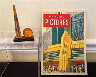 Dining Room: Two vintage World's Fair items are displayed.  On the left is a 1939 New York World's Fair Thermometer with a Trylon/Perisphere on a Bakelite base.  It is 3-1/2" tall.  On the right is an  "Official Pictures"  booklet (circa 1933) which has wonderful photos of pavilions and interesting architecture during the Chicago World's Fair.