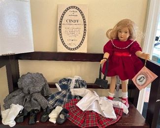 Dining Room:  An EFFANBEE Cindy doll (The Modern Cinderella) has her original box, Certificate  of Authenticity, four outfits, two pairs of socks and shoes, and her handbag (of course!).  The original Cindy was created by Dewees Cochran in the 1940's.