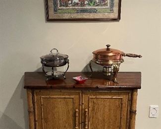 Lower Level:  This vintage LAMMERTS two-door chest has two interior shelves.  It measures 42" wide x 14" deep x 30" tall.  Wouldn't it be great painted a bright red lacquer!  The silver-plate and copper/brass chafing sets and wall art are also for sale.