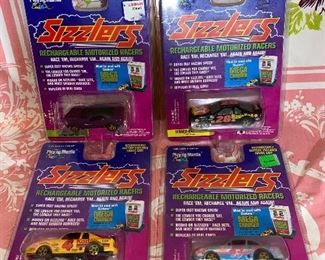4 Sizzler Rechargeable Motorized Racers $24.00