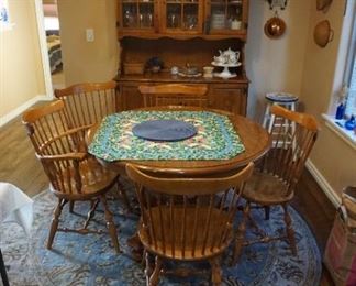 Dining Table with chairs. China Hutch, rug