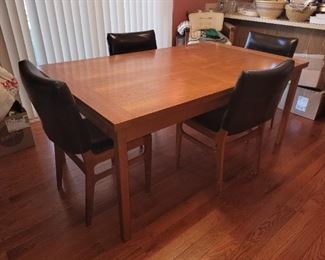 Priced separate- $600 Vintage Danish Modern Teak Expandable Dining table 39.25" x 67", 106" long open, Some gentle marring on top- ask for more pictures  $40 ea(4)Vintage leather/teak chairs, see pictures, original chairs reupholstered with black leather seat and leather "sleeve" back ( see pictures)