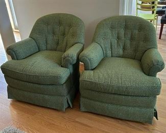 Two green swivel rockers
