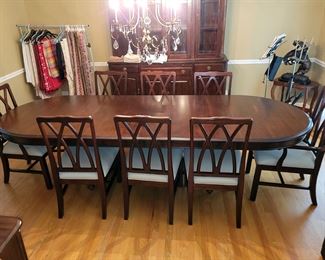 Upholstery on chairs is a neutral beige herringbone 