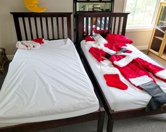 Matching twin beds. Santa costume