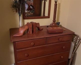 Vintage dresser with wood lamp and wood shoe bookends. 