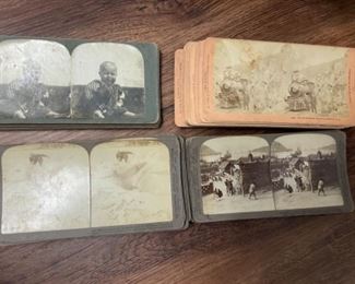 Stereoscope viewing cards and two steroscopes.