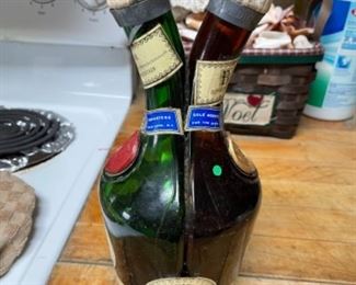 Vintage distressed look French DOM Benedictine & Brandy Dual-Head bottle.