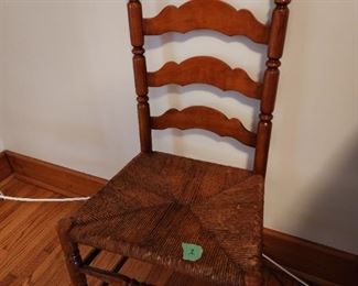 Matching set of Vintage Ladderback dining chairs, built with extra support decorative dowels in the front. The Rush Seats are in excellent condition. 