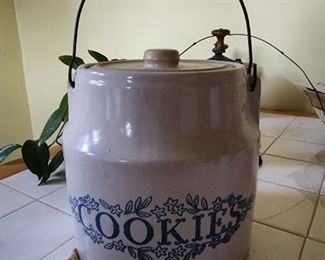 Made in Monmouth IL 
Stoneware cookie jar with wire handle