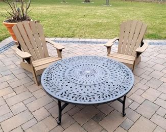 Firepit table. Adirondack chairs. Live fig tree in planter