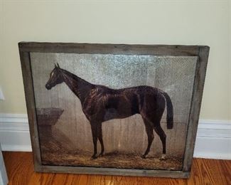 Metallic horse art in rustic frame
