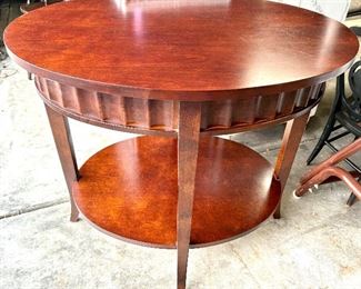 Crate & Barrel oval, cherrywood finish two-tier side table 32” x 25” x 29”h $139