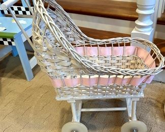 Antique, white rattan, baby doll carriage with wheels 
21 long x 9”w x 22”h $45