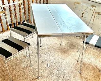 Vintage, white metal language table & 4 chair base table set in need of cleaning 
Table 48”long x 29d x 30.5h
Chairs 17w x -5.5d x 32h $100