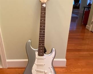 Squire electric Stratocaster guitar by Fender w/ stand 