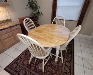 Dinning room table and 4 chairs. This set has 2 more chairs and leaf.