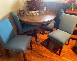 Round up table with leaf for upholstered chairs