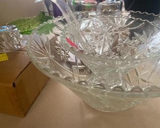 Crystal punchbowl with stand and 12 cups.