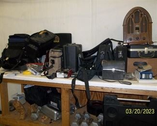 this shelf has electronics...movie cameras, video recorders, laptops, cameras, etc.