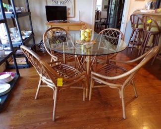 round rattan & glass top table with 4 chairs (need cushions)