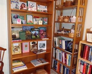 tall wood bookcase with slide in shelving, books, baskets, etc.