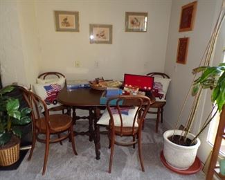 Oval dropleaf table, bentwood ice cream parlor chairs, plant, artwork, etc.