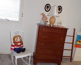 white rocking chair, maple chest of drawers, etc.