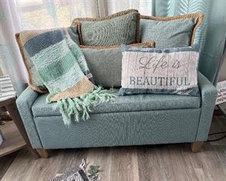 Seafoam green storage bench, decorative pillows