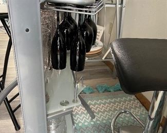 Glass top mini bar with three stools
