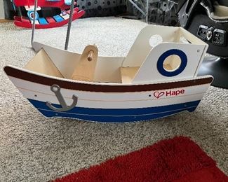 Child's wood boat which rocks