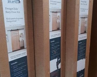 JELD-WEN Unfinished 1-panel Plank Frosted Glass Barn Door Kit with Slab Door and Design Glide Hardware - New - Still in original box - 3 Doors - Sold Separately.  Fits 6'8" Opening Height - All three Brand New