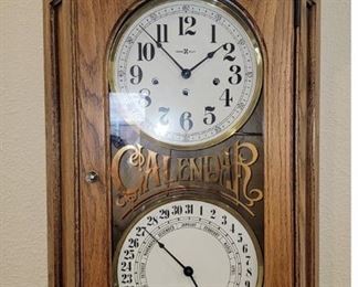 Howard Miller Pendulum Calendar Wall Clock