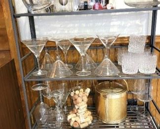 Bar items:  decanters, martini glasses, mid-century tumblers, ice buckets.  Wine books