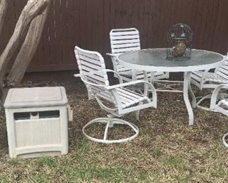 Patio table set with 4 chairs.  2 hose caddies