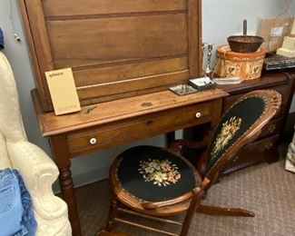 Antique plantation desk with fold down front. Victorian style rocker with needlepoint back and seat.