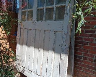 Monumental pair of property's original garage doors...