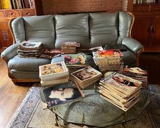 3 person leather sofa, vintage glass coffee table, lots of vintage magazines