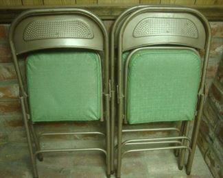 Set of folding chairs with green vinyl