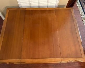 Beautiful antique drop leaf rolling serving cart with glass insert and side drawer.                                                                 
29"H x 43"W extended x 32"D