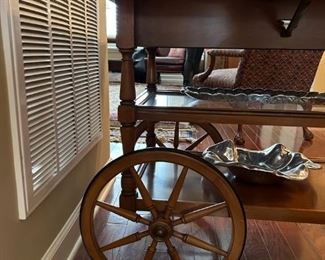 Beautiful antique drop leaf rolling serving cart with glass insert and side drawer.                                                                 
29"H x 43"W extended x 32"D