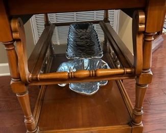 Beautiful antique drop leaf rolling serving cart with glass insert and side drawer.                                                                 
29"H x 43"W extended x 32"D