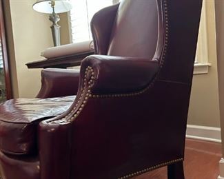 Leather burgandy wing chair: 42.5"H x 32"W x 5"D