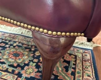 Leather burgandy wing chair: 42.5"H x 32"W x 5"D