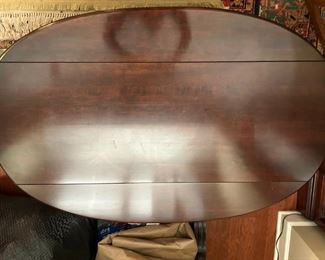 Oval drop leaf coffee table: 17.5"H x 32"W x 19"D