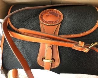 Never used, in original box, Dooney & Bourke bag purse. More pocketbooks also
